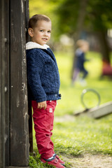 Canvas Print - Cute boy by the tree