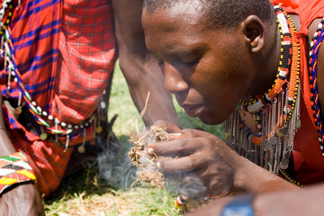masai making fire in masai mara national park
