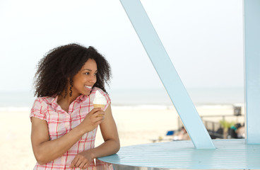 Poster - Beautiful young black woman enjoying ice cream