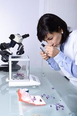 Geologist studies the precious stones.