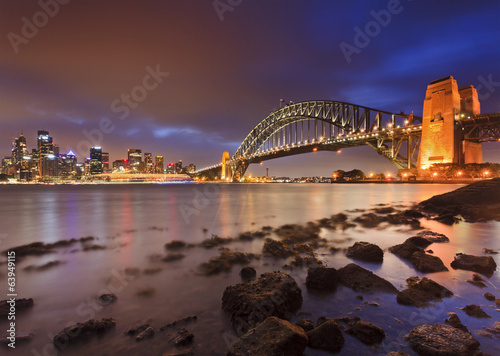 Fotoboard na płycie Sydney cbd bridge rocks low tide