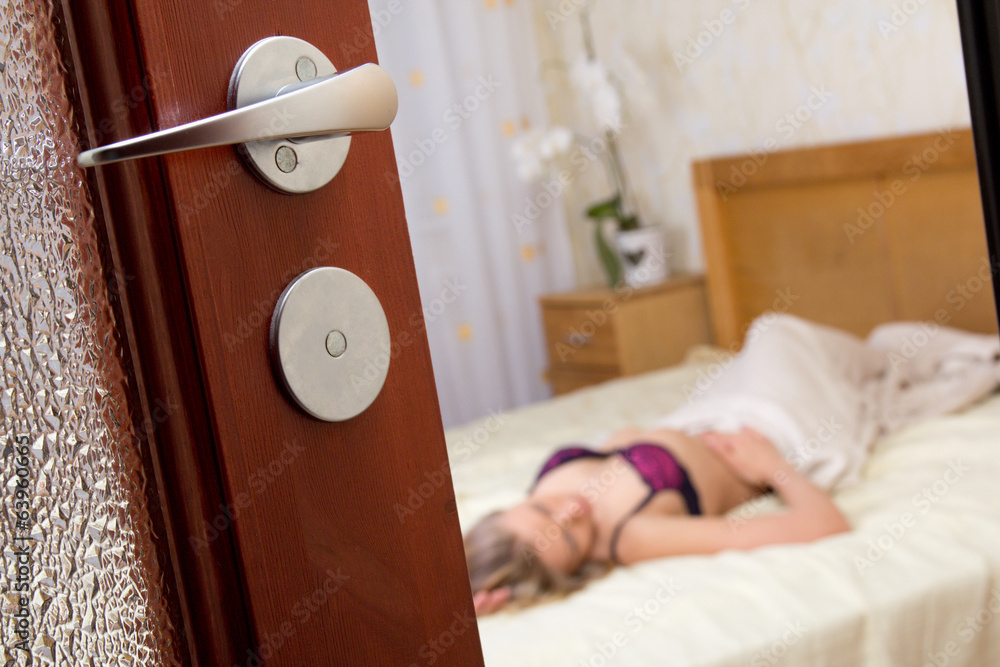 voyeurism - woman in lingerie - view through bedroom door Stock Photo |  Adobe Stock