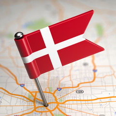 denmark small flag on a map background.