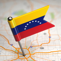 venezuela small flag on a map background.