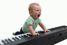 Half-year-old Baby Playing The Piano And Singing