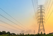 © idoza - High voltage power lines at sunset.