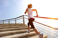 Fitness Woman Running On Stone Stairs Seaside