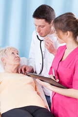 Poster - Elderly woman having medical examination