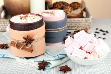 Fototapete - Mug of hot drink decorated in felt on wooden table