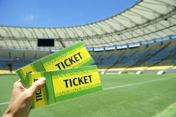 Wall Mural - Soccer Fan Holding Two Brazil Tickets at the Stadium