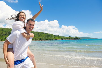 happy couple have fun on the beach