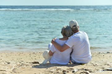 Canvas Print - Amusing elderly couple on a beach