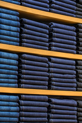 Wall Mural - Neat stacks of folded clothing on the shop shelves