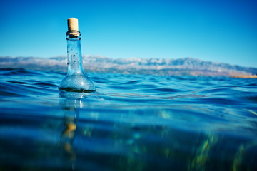 Wall Mural - Bottle with a message in water