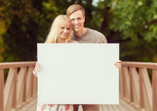 Couple On The Bridge With Blank White Board