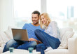 © Syda Productions - smiling happy couple with laptop at home