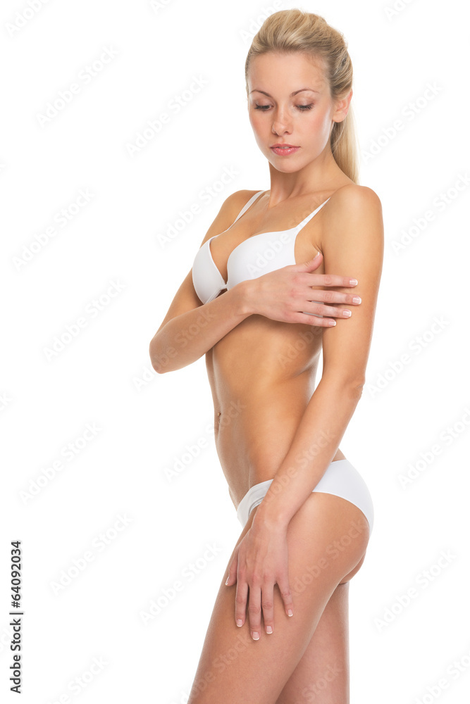 Portrait of young woman in lingerie checking skin condition - obrazy, fototapety, plakaty 