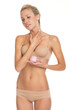 © Alliance - Young woman in lingerie applying creme on neck