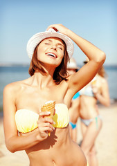 Poster - girl in bikini eating ice cream on the beach