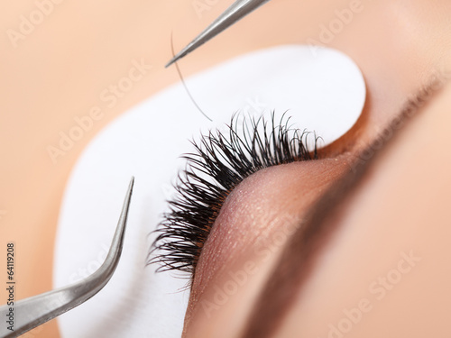 Poster Woman Eye with Long Eyelashes. Eyelash Extension