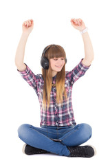 Wall Mural - cute teenage girl  listening music in headphones and dancing