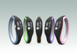 Colorful smart wristbands on gray background