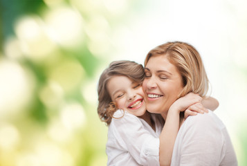 Wall Mural - happy mother and daughter hugging