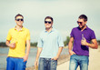 © Syda Productions - friends on the beach with bottles of drink