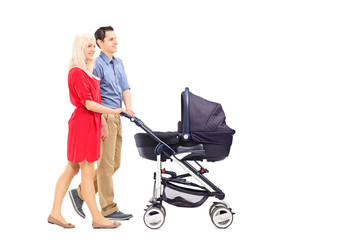 Wall Mural - Young parents pushing a baby stroller