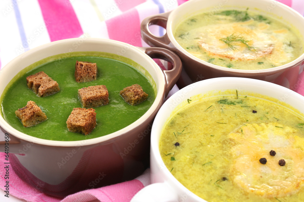 Tasty soup in saucepans, close up