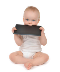 Infant child baby toddler eating digital tablet mobile computer