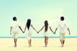 © Odua Images - best friend in white walking together holding each other hand