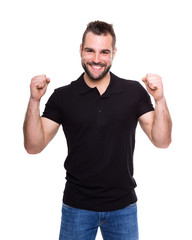 Wall Mural - Young happy man in a black polo shirt