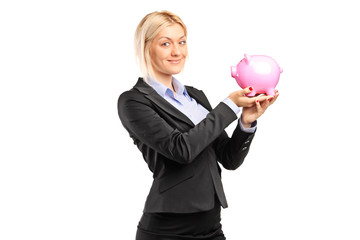 Poster - Happy businesswoman holding a piggybank