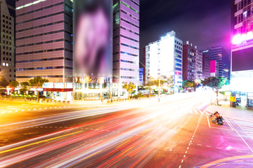 Car light trails and urban landscape in modern city