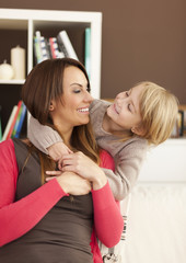 Wall Mural - Mother and her daughter having fun at home