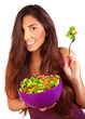 Sportive girl eating fresh salad