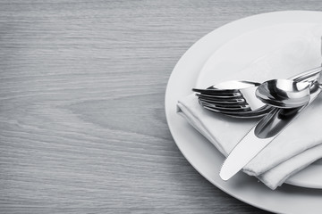 Silverware or flatware set of fork, spoons and knife on plate