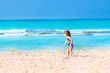 © famveldman - Toddler girl playing on a beach