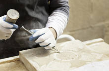 Man Carving Stone