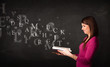 © ra2 studio - Young lady reading a book with alphabet letters
