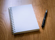 © sirastock - Blank Catalog on the wooden Background