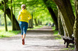 © blas - Woman runner running jogging in summer park