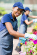 african american female florist in nursery