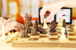 © Africa Studio - Woman playing chess, close up
