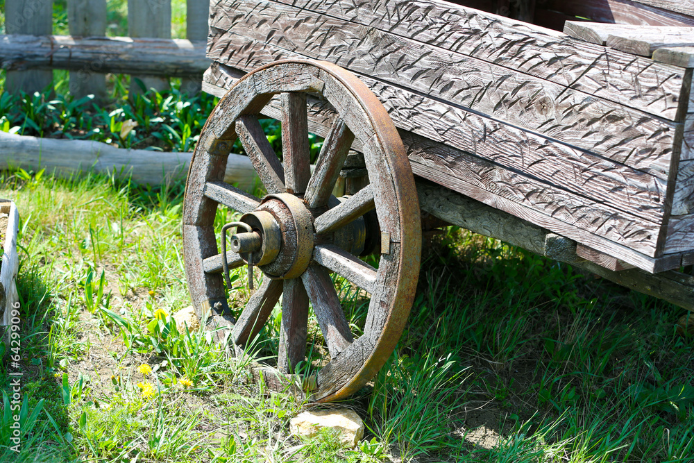 Wooden cart on nature background