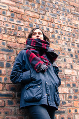 Wall Mural - Model wearing tartan scarf and barbour style jacket