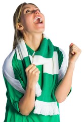 Wall Mural - Cheering football fan in green jersey