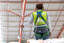 Warehouse Worker With Safety Harness Secuerity For Fall Protecti