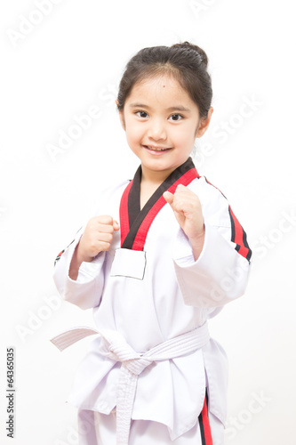Leinwand Poster Little asian child in fighting action on isolated background
